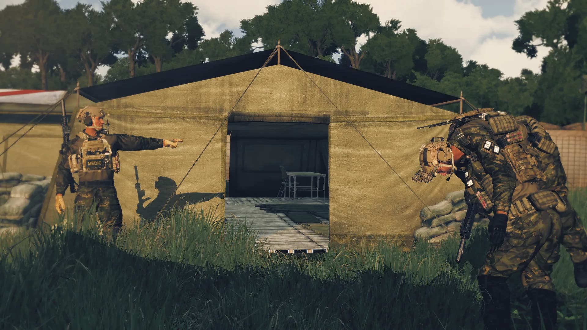 Combat medics working a casualty at a forward aid station