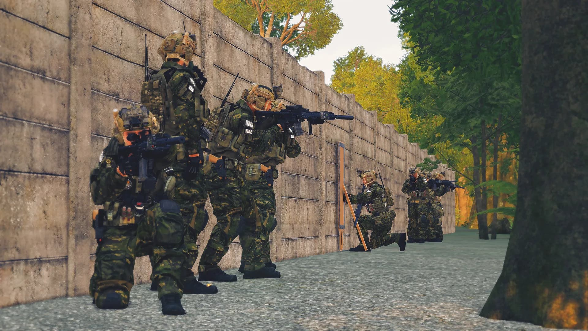 Squad stacked along a wall during a combat engineer exercise