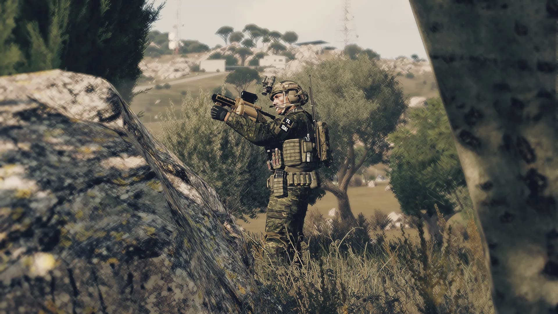 Grenadier holding a treeline with an underslung launcher